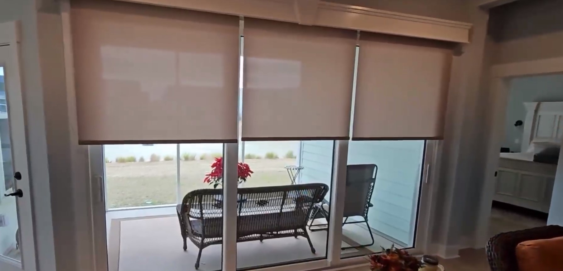 shades rolling automatically using motorization looking out to patio